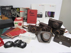 lot 4 image: Large Lot of Vintage LEICA Camera Accessories Books Leather Cases etc