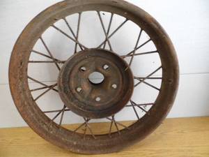 lot 63 image: Antique Car Wheel