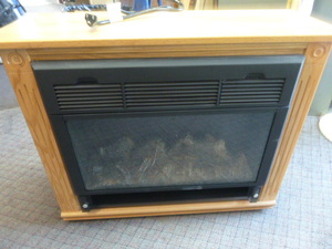lot 36 image: Heat Surge Electric Fireplace