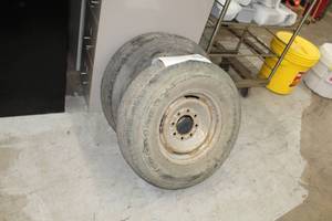 lot 12 image: Lot of (2) Firestone Steeltex Radial R4S, Goodyear LT24575R16 Light Truck Tires with 8-Lug 16in. Rims