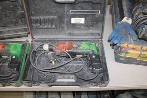 lot 57 image: Chicago Pneumatic 34in. Rev. Hammer PHE 20 RL-N, Case