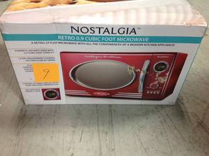 lot 9 image: Nostalgia Retro 0.9 cu. Ft. Countertop Microwave Oven in Retro Red not used