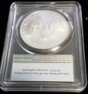 lot 06 image: 2003 AMERICAN SILVER EAGLE 1 TROY OZ. .999 FINE SILVER MS69 PCGS FIRST STRIKE