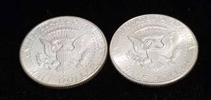 lot 14 image: 2 AU-UNC 1964 KENNEDY SILVER HALF DOLLARS