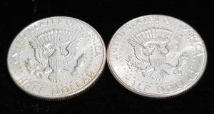 lot 27 image: 2 UNC 1964 KENNEDY SILVER HALF DOLLARS