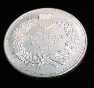 lot 32 image: 1 TROY OZ. .999 FINE SILVER SEATED DOLLAR DESIGN
