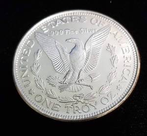 lot 35 image: 1 TROY OZ. .999 FINE SILVER MORGAN DOLLAR DESIGN