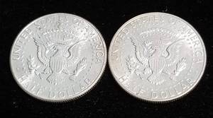 lot 46 image: 2 AU-UNC 1964 KENNEDY SILVER HALF DOLLARS