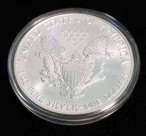 lot 65 image: 1991 AMERICAN SILVER EAGLE 1 TROY OZ. .999 FINE SILVER IN AIRTITE