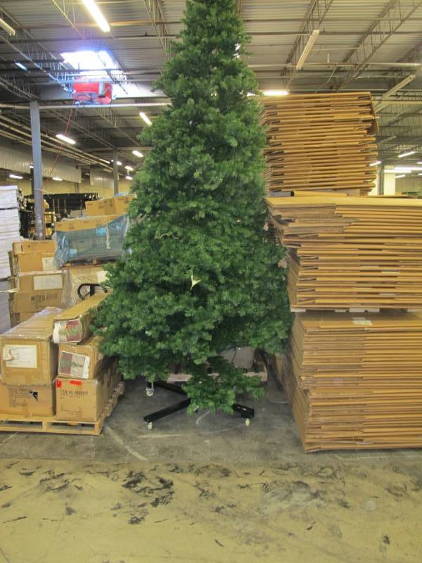 Artificial LED Tree in green, roughly 15 feet tall by Vickerman - On Wheeled Base