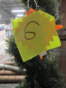 Artificial Tree in green, roughly 6.5 feet tall by Vickerman