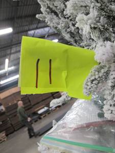 Artificial Tree in green with fake snow covering, roughly 7 feet tall by Vickerman
