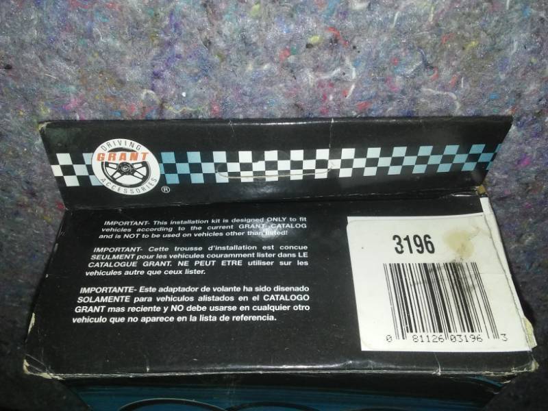 lot 55 image: Grant steering wheel installation kit. new in box.