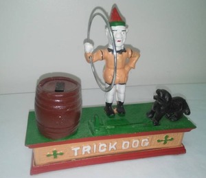 lot 31 image: Cast metal Bank Trick Dog 8 in. long.