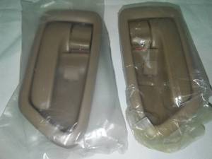 lot 163 image: Toyota Camry interior door handles Left and Right, 1997 - 2001 new OEM tan.