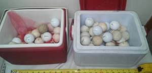 lot 165 image: 2 Coolers of golf balls, Nike, Titleist, Calloway & more.