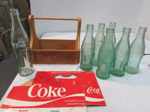 lot 34 image: Vintage Coca Cola Bottles and Carrier