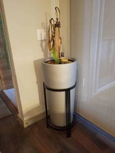 lot 137 image: Contemporary Pewter Resin Planter in a Black Iron Stand