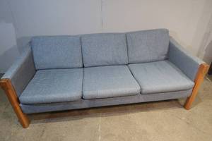 lot 1 image: Blue Sofa with Wooden Legs