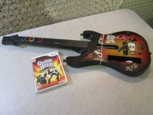 lot 45 image: Wii Guitar Hero World Tour Game and...