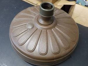 lot 109 image: Resin Umbrella Base...
