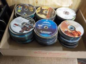lot 161 image: 300 or more DVDs, CDs and Games...