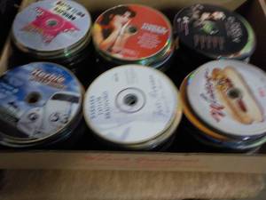 lot 162 image: 300 or more DVDs, CDs and Games...