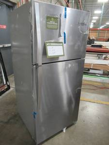 lot 310 image: Whirlpool 18.2-cu ft Top-Freezer Refrigerator (Monochromatic Stainless Steel) WRT318FZDM, - USED - Missing 1 Crisper Drawer and Freezer Door Tray Guard.