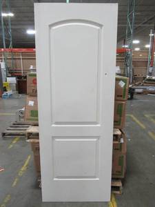 lot 354 image: Reliabilt 30 X 80 Two Panel Hollow Core Door Slab With Arched Top Panel, No Bore - ScratchesPrimer Chips - Small Hole On Side Of Top Panel.