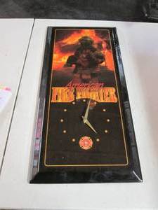 lot 212 image: Firemans American Firefighter Wall Clock (Battery Operated) 4C