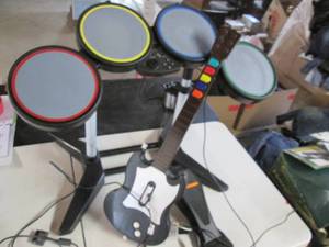 lot 215 image: Rock Band Wired Drum Set & Guitar Playstation  Model #PSLGH)