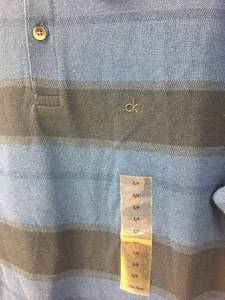 lot 7 image: Calvin Klein Blue Polo Style Shirt - Small