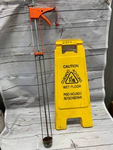 Smooth Parallel Caulking Gun & Wet Floor Sign