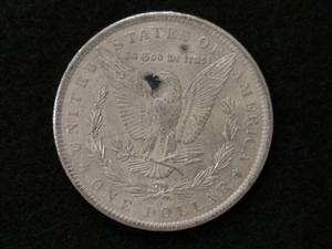 lot 15 image: 1885 O Morgan Silver Dollar...