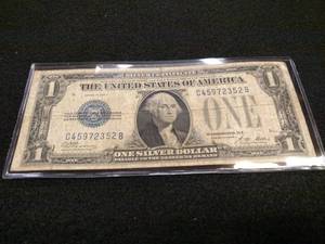 lot 224 image: 1928 A Funny Back One Dollar Silver...