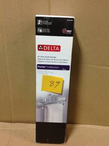 lot 89 image: Delta Porter 18 in. Towel Bar with Glass Shelf in Brushed Nickel not used