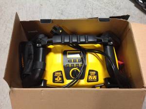 lot 94 image: DEWALT 2800 Peak Amp Jump Starter 1000-Watt Power Inverter with Digital Compressor in very good condition