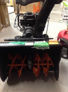 lot 126 image: Power Care 24 in. Two-Stage Gas Snow Blower with Electric Start and Headlight in working conditions