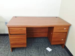 lot 36 image: Wood Laminate Oversized 5 Drawer Office Desk With 2 Grommets For Electrical - Looks Never To Have Been Used But Has Scuffs On Edges
