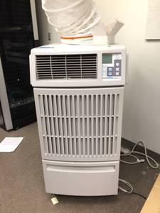 lot 54 image: WOW $3200 MOVINCOOL Office Pro 12 Portable Air Condition With 12,000 BTU&nbspCapacity, ETL Certified, Digital Control, Electronic Thermostat, Centrifugal Fan Type, and 820 CFM Air Flow, in White - Excellent Working Condition - Keep Your Servers Cool