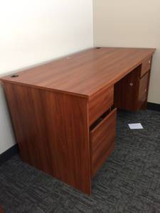 lot 38 image: Wood Laminate Oversized 5 Drawer Office Desk With 2 Grommets For Electrical - Looks Never To Have Been Used But Has Scuffs On Edges