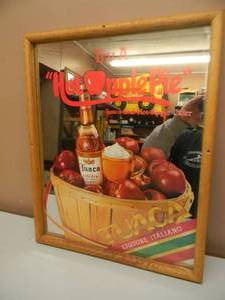 lot 15 image: TUACA (HOT APPLE PIE) LIQUOR MIRROR - APPROX 17 BY 21 - SEE PICTURES