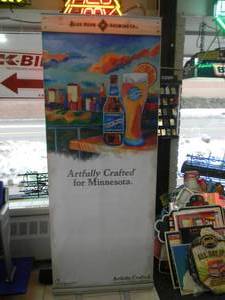 lot 40 image: BLUE MOON, ARTFULLY CRAFTED FOR MINNESOTA - Retractable display banner stand  easy to set up and take down OR CAN BE HUNG - LARGE VERY COOL APPROX 30 X 80 - SEE PICTURES