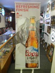 lot 47 image: COORS LIGHT BEER - Retractable display banner stand  easy to set up and take down OR CAN BE HUNG - LARGE VERY COOL  APPROX 30 X 80 - SEE PICTURES