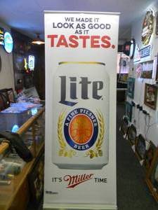 lot 50 image: MILLER LITE BEER - Retractable display banner stand  easy to set up and take down OR CAN BE HUNG - LARGE VERY COOL  APPROX 30 X 80 - SEE PICTURES