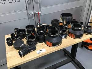 lot 21 image: Huge lot of black plumbing fittings
