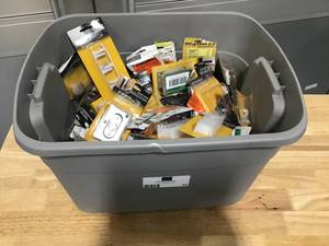 lot 25 image: Bin filled with PLPCI accessories - Closet and door fittings