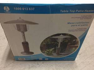 lot 73 image: Hampton Bay 11,000 BTU Powder Coated Bronze Tabletop Propane Patio Heaterin good condition