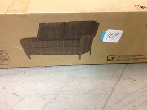 lot 109 image: Hampton Bay Cambridge Brown Wicker Outdoor Patio Loveseat with Standard Midnight Navy Blue Cushions not used