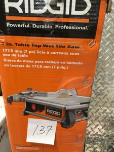 lot 137 image: Ridgid 6.5 Amp Corded 7 in. Table Top Wet Tile Saw in very good condition